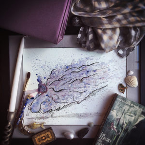 A print of the painting, "Dancer in Shadow", by Melani Grube, forms the base of a flatlay arrangement of items, including a candle, scarf, paintbrush, book of poems by Baudelaire, and seashells.